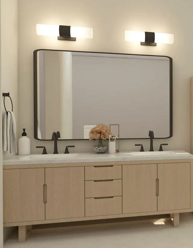 3D design of the vanity wall, with a light oak double vanity, one wide black-framed mirror and black faucets