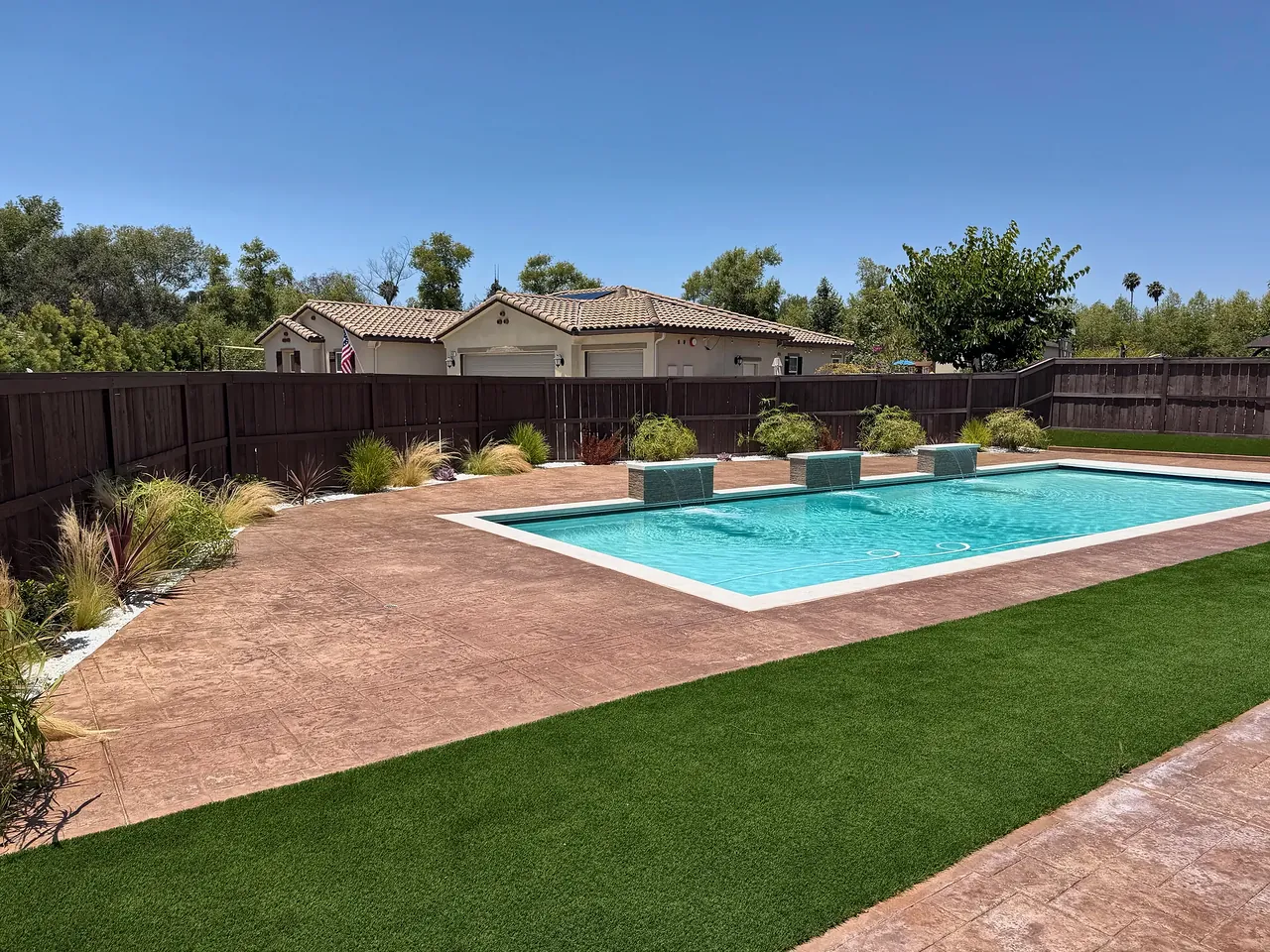 The backyard with the planters grown in