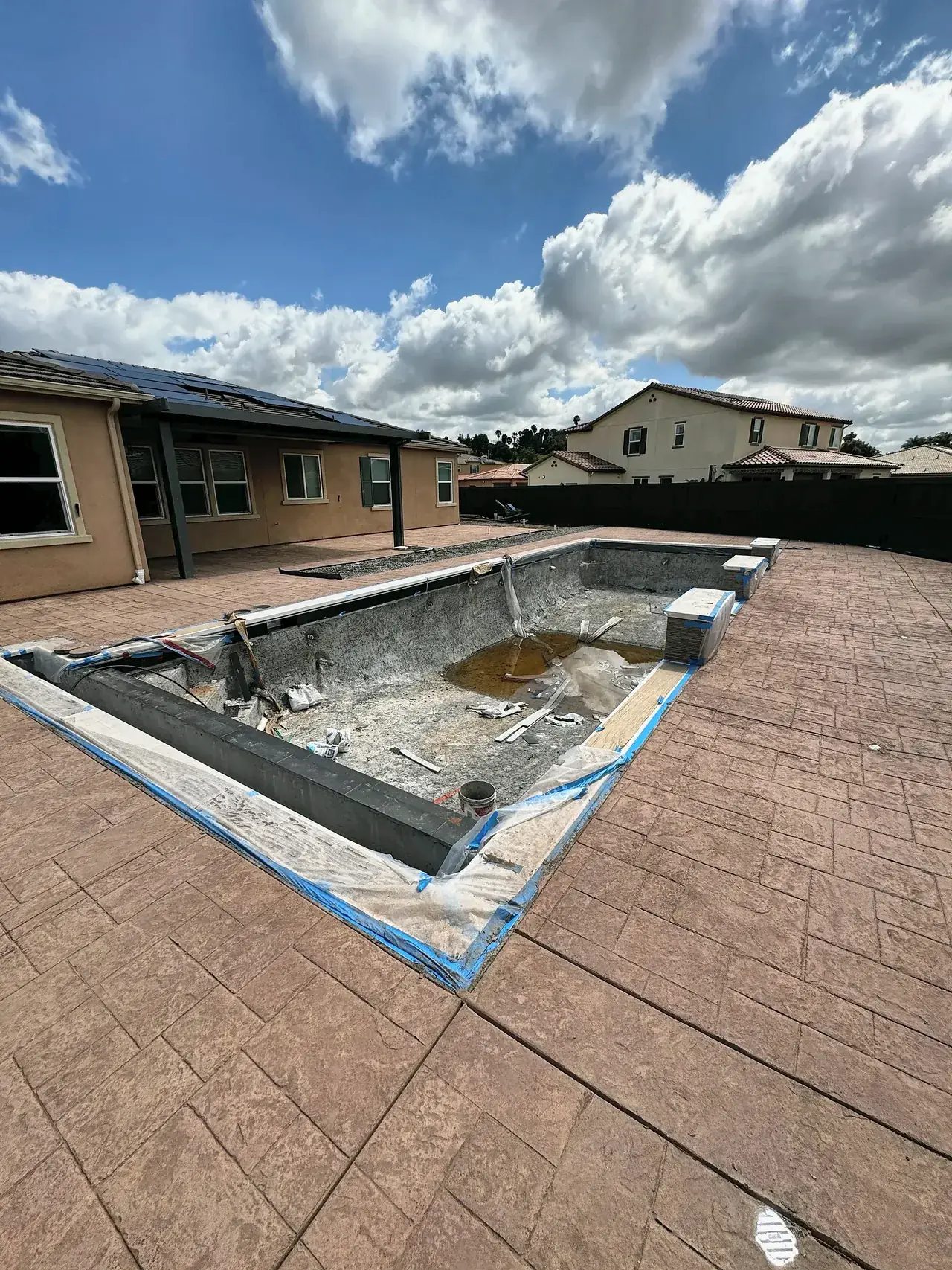 Stamped concrete deck poured around the pool