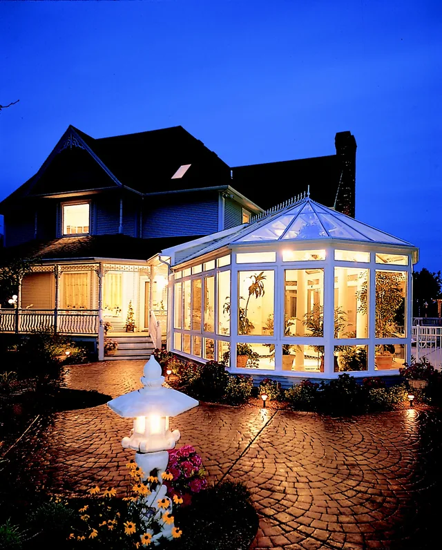 Four Seasons Victorian conservatory lit up at dusk