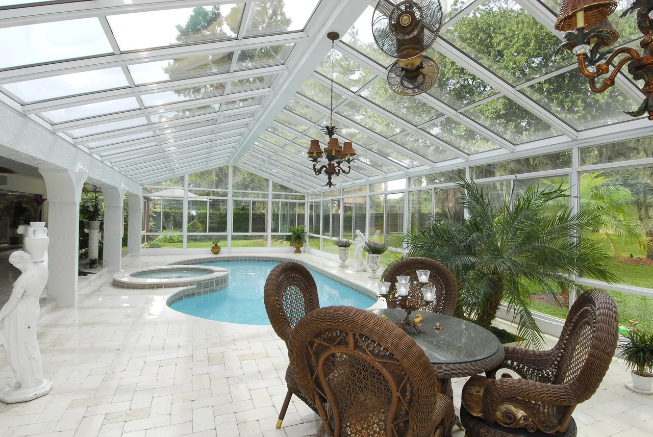 Four Seasons Cathedral glass roof sunroom over an indoor pool